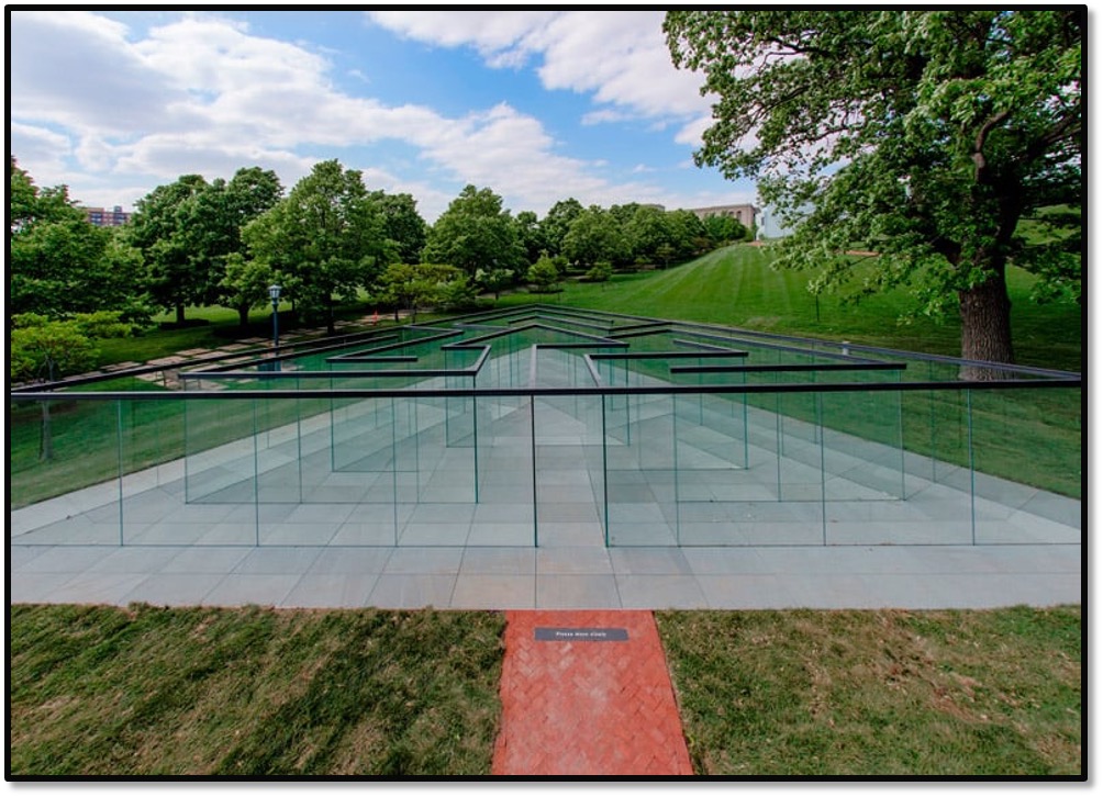 A triangular-shaped, glass-walled labyrinth designed by acclaimed artist and Kansas City native Robert Morris is being installed in the Donald J. Hall Sculpture Park at The Nelson-Atkins Museum of Art. This dynamic sculpture will provide visitors with an intimate experience, enticing them to interact with the art by winding through the glass maze.